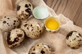 Composition of several quail eggs on decorative fabric on a wooden table close-up, flatlay Royalty Free Stock Photo