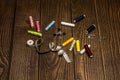 A composition of sewing items with various spools of colored thread, a group of safety pins, buttons, a tape measure, scissors, a Royalty Free Stock Photo