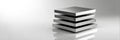 Four Metal Plates Stacked in Balanced Formation on a Reflective Surface Royalty Free Stock Photo