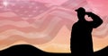 Composition of silhouetted saluting soldier over sunset sky and billowing american flag