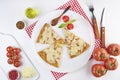 Sliced pizza with ingredients on white background. Top view, flat lay Royalty Free Stock Photo