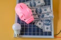 Composition with solar panel, led lamp, money and piggy bank Royalty Free Stock Photo