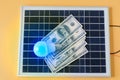 Composition with solar panel, led lamp, money Royalty Free Stock Photo