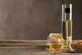 Composition with soybean oil on wooden table. Space for text Royalty Free Stock Photo