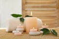 Composition of spa stones, towel and burning candles Royalty Free Stock Photo