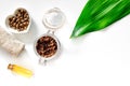 Composition of spa treatment. Coffee scrub, coffee soap and oil on white background top view copyspace