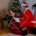 Composition of st nicholas day text over santa claus holding scroll with sack of presents Royalty Free Stock Photo