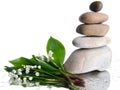 Composition of stacked pebbles with a bouquet of lilies Royalty Free Stock Photo