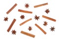 Composition of star anise and cinnamon sticks isolated on white. Abstract pattern flat lay, top view Royalty Free Stock Photo