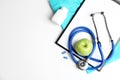 Composition with stethoscope, apple and clipboard on light background. Medical equipment Royalty Free Stock Photo