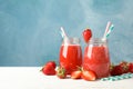 Composition with strawberry cocktails on wooden table. Summer berry Royalty Free Stock Photo