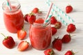 Composition with strawberry cocktails on wooden table. Summer berry Royalty Free Stock Photo