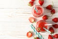 Composition with strawberry cocktails on wooden table. Summer berry Royalty Free Stock Photo