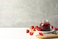 Composition strawberry jam on wooden table against gray background Royalty Free Stock Photo