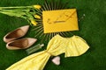 Composition with stylish women`s clothes and accessories for spring on green grass