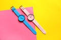 Composition with stylish wrist watches on color background, flat lay.