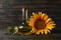 Composition with sunflower, oil and seeds on wooden Royalty Free Stock Photo