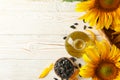 Composition with sunflower, seeds and oil on wooden background Royalty Free Stock Photo