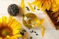 Composition with sunflower seeds and oil on white wooden background Royalty Free Stock Photo