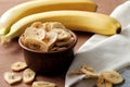 Composition with sweet dried banana slices, fresh bananas. Top view with space for text. Dried fruit as healthy snack Royalty Free Stock Photo