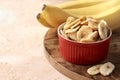 Composition with sweet dried banana slices, fresh bananas. Top view with space for text. Dried fruit as healthy snack. Royalty Free Stock Photo