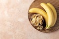 Composition with sweet dried banana slices, fresh bananas. Top view with space for text. Dried fruit as healthy snack. Royalty Free Stock Photo