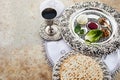 Composition with symbolic Passover, Pesach, items and meal on stone background,