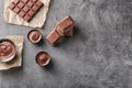 Composition with tasty melted chocolate on grey background, top view Royalty Free Stock Photo