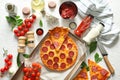 Composition with tasty Pepperoni pizza and ingredients on table