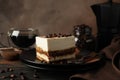 Composition with tasty tiramisu and coffee on background