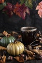 Composition with tea cup and ceramic pumpkins