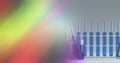 Composition of test tubes of blue liquid in rack, with blurred colourful copy space Royalty Free Stock Photo