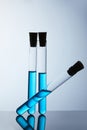 Composition of test tubes filled with blue liquid Royalty Free Stock Photo