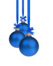 Composition from three blue christmas balls hanging on ribbon Royalty Free Stock Photo