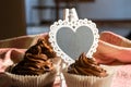 Composition of Three Chocolate Cup Cakes and a Heart-Shaped Blackboard Royalty Free Stock Photo