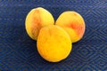 Composition three juicy ripe yellow peach sweet fruit base of dessert jam on blue background base design