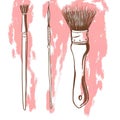 Three painting brushes on a pink background.
