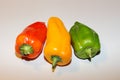 Composition of three peppers: red, yellow, green. Royalty Free Stock Photo
