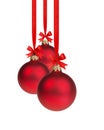 Composition from three red christmas balls hanging on ribbon Royalty Free Stock Photo