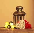 Composition with tin grey decorative lantern on wooden background