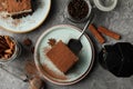 Composition with tiramisu coffee and cinnamon on gray table Royalty Free Stock Photo