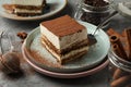 Composition with tiramisu coffee and cinnamon on gray table Royalty Free Stock Photo