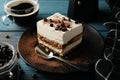 Composition tiramisu and coffee on wooden background. Tasty dessert