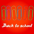 Composition to 1 September. Colored paper clips on a red field. Background with the words Back to School. Vector illustration. Royalty Free Stock Photo
