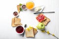 Composition of toasted bread with sweet jam, butter and chocolate paste on white table Royalty Free Stock Photo