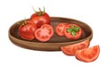 A composition of tomatoes on a tray made of wood. Tomatoes in slices, triangles, with a basil leaf