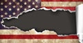 Composition of torn american flag with ripped section missing, revealing dark grey background