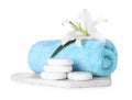 Composition with towel, spa stones and flower isolated on white Royalty Free Stock Photo