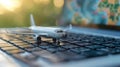 Composition with toy plane and laptop on table. Travel and information Concept. Mini airplane toy model. Royalty Free Stock Photo