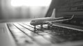 Composition with toy plane and laptop on table. Travel and information Concept. Mini airplane toy model. Royalty Free Stock Photo